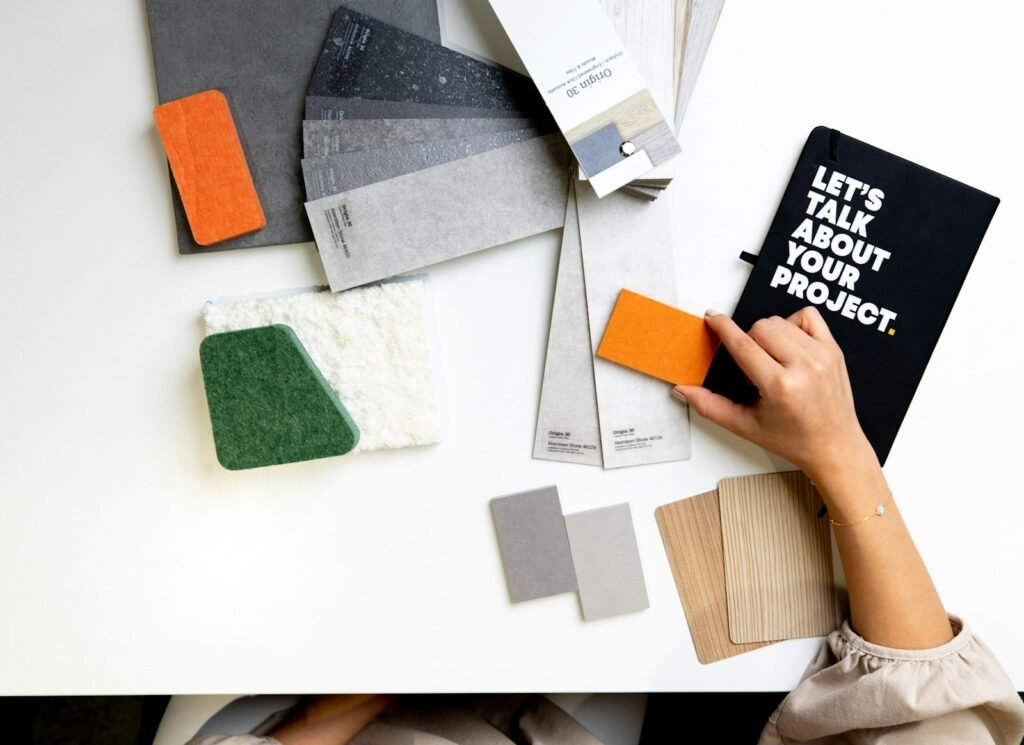Designer comparing color and material samples on a desk to build taste in design